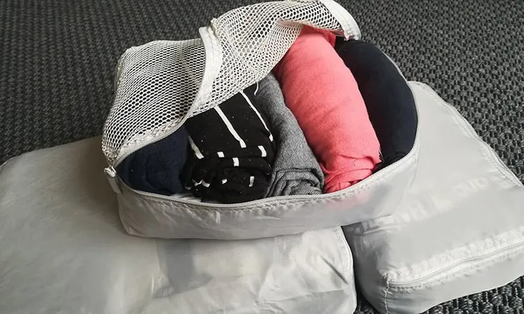 t-shirts rolled inside ikea packing cubes