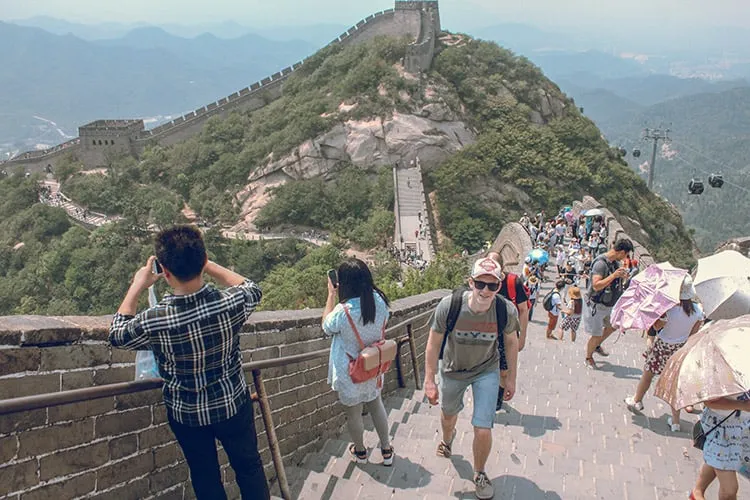 A man walking the great wall of china