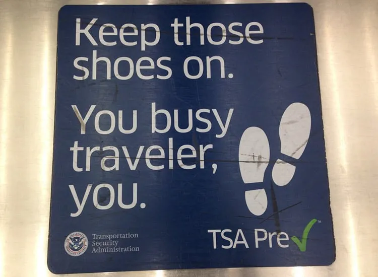 TSA precheck sign in an airport