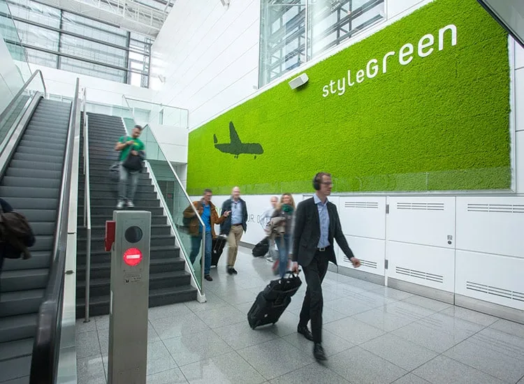 a man in a suit walking to the airport security