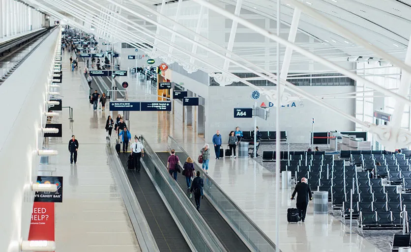 People walking to their gates inside an airport