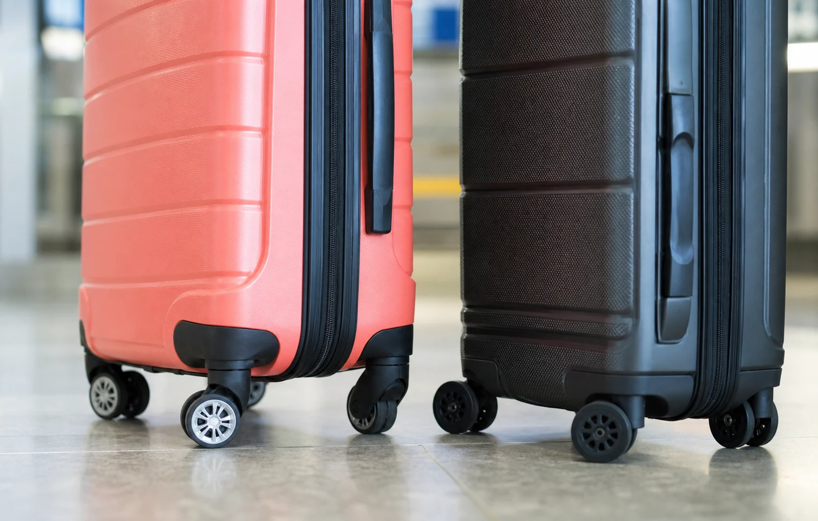 Close-up of suitcase wheels and shell details for American Tourister vs Samsonite comparison