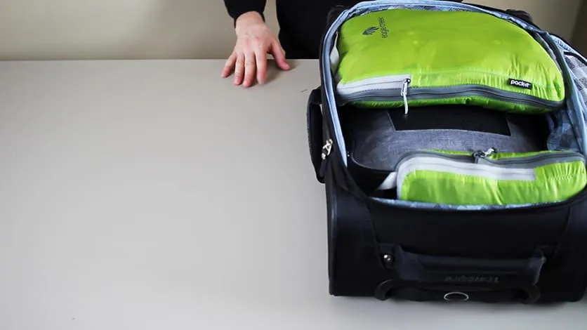 a carry-on packed with compression cubes