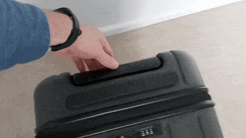 testing the retractable handle of chester luggage