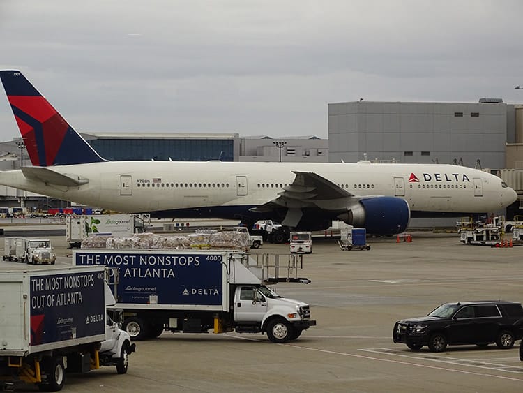 delta airplane in the atlanta airport boarding for a domestic flight