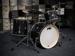 A drum set in a dark studio