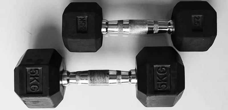 A set of dumbbells on white background