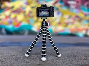 A gorilla tripod holding a dslr camera