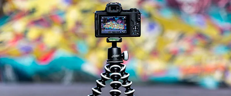 A gorilla tripod holding a dslr camera