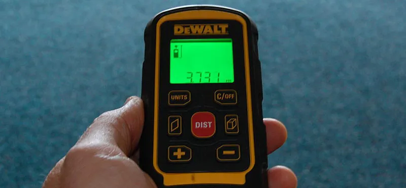 Electronic Laser measure held in hand
