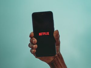 A man watching netflix on a phone