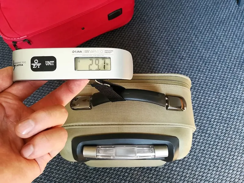 https://www.cleverjourney.com/wp-content/uploads/measuring-luggage-weight-with-a-scale-featured-image.jpg