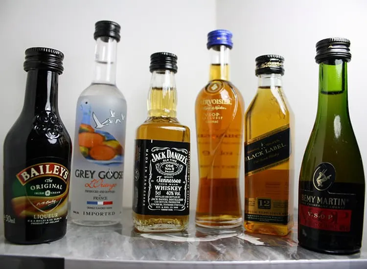 mini liquor bottles stacked in a line