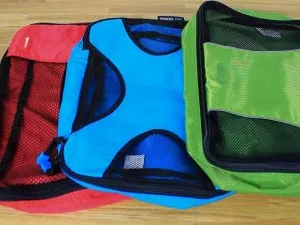 Multiple packing cubes laid out on a table