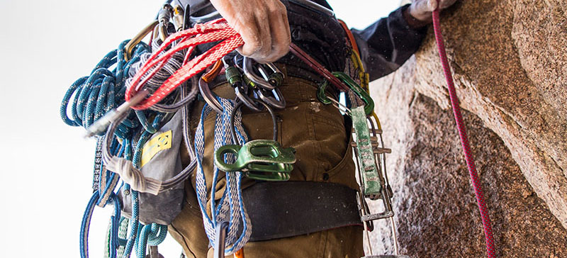 Rock climber with climbing gear