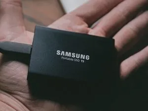 A samsung hard drive held in a hand